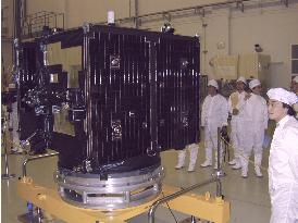 Media get glimpse of test satellite to measure radiation